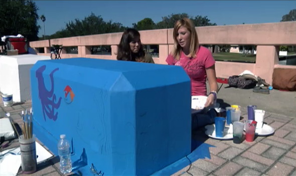 Gulf art students helped paint benches on the Main Street bridge